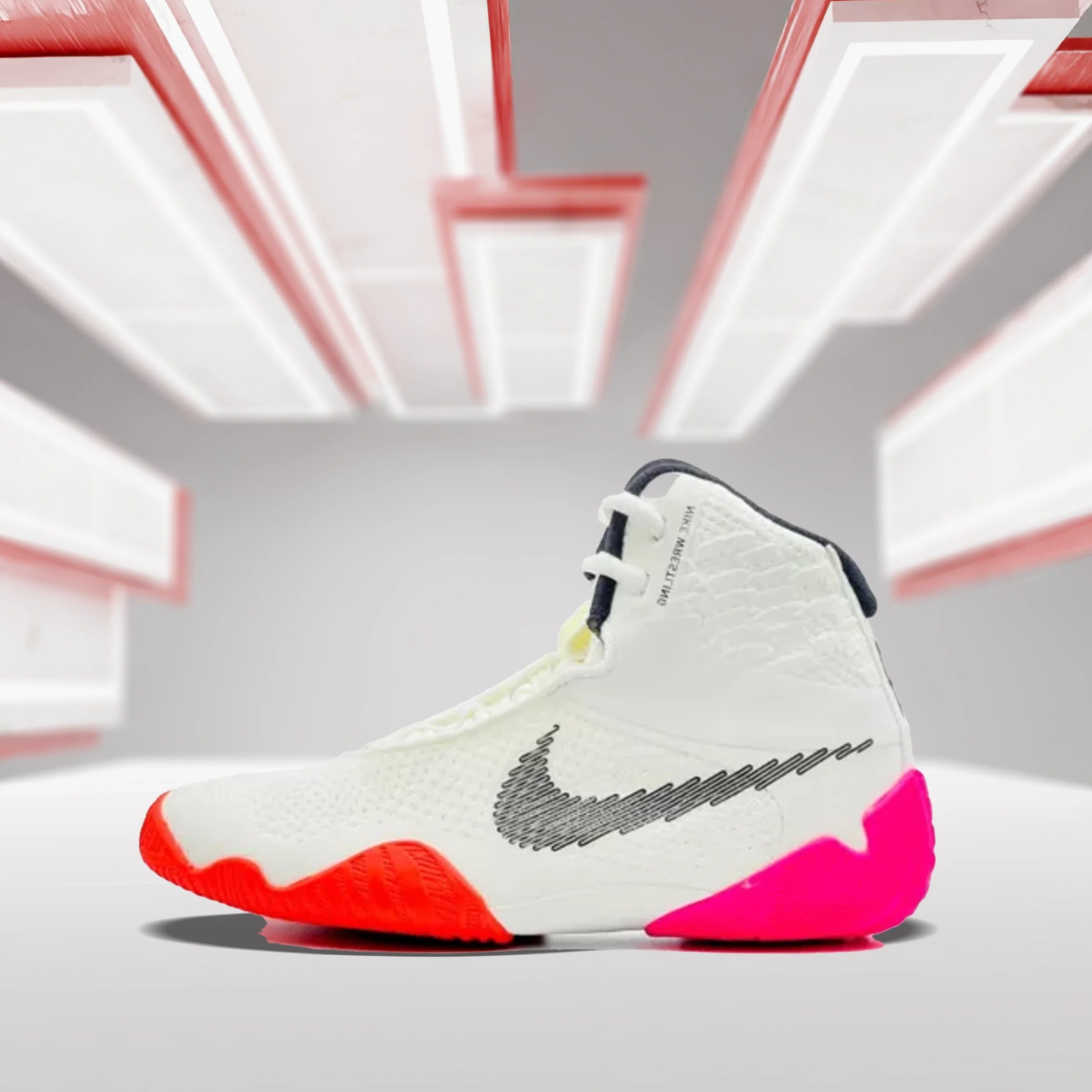 A vibrant pair of boxing shoes displayed on a gym floor.