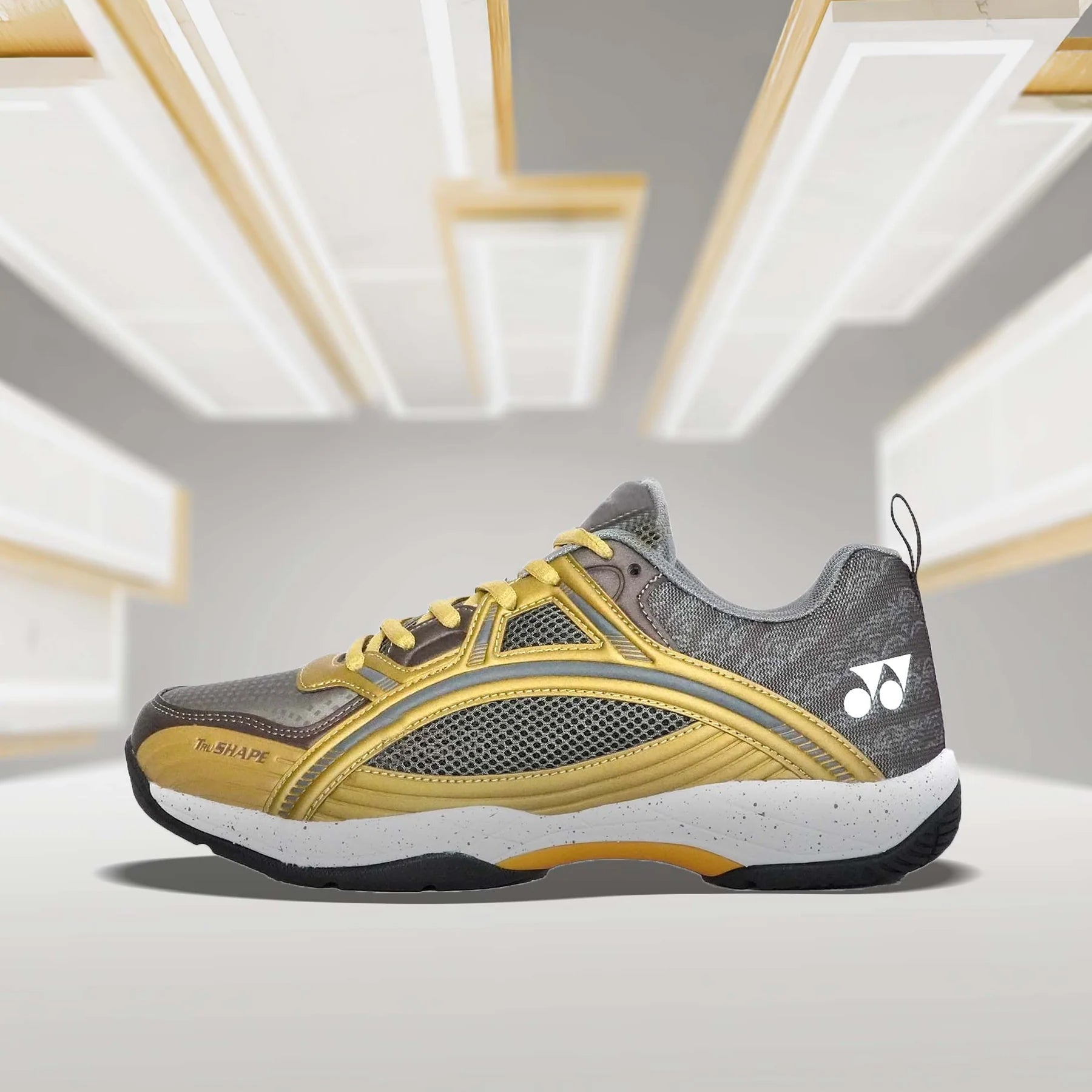 YONEX Tokyo Ultima Badminton Shoes in Dark Brown/Bright Gold on clean background