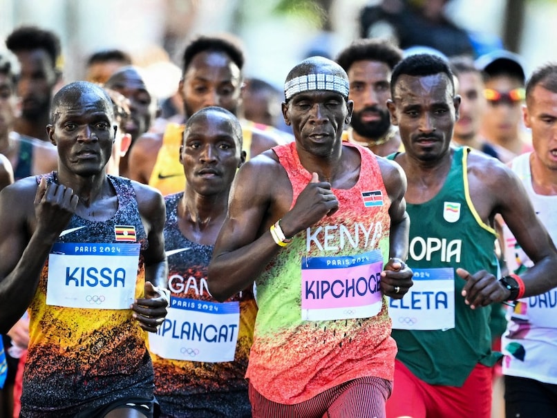 Eliud Kipchoge Retires from Marathon Running, Hands Over Shoes to Fan