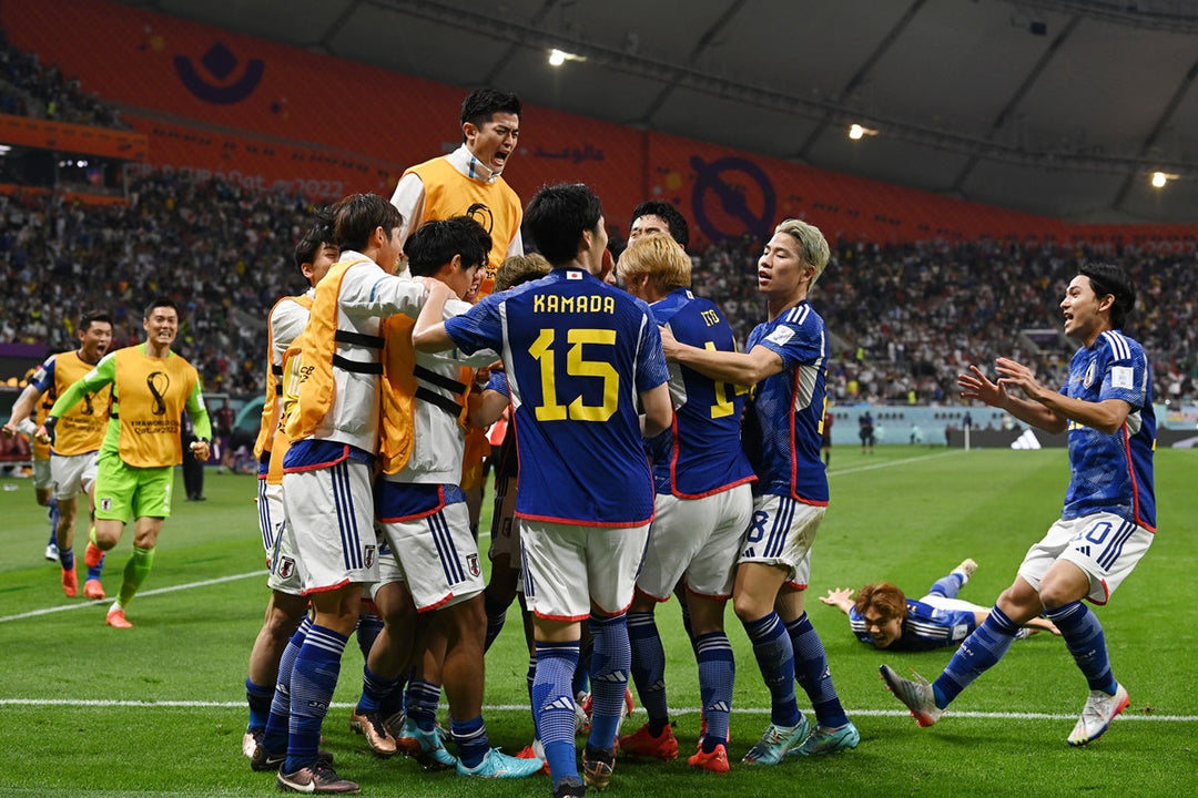 Team of Japan football players is celebrating winning moment in FIFA