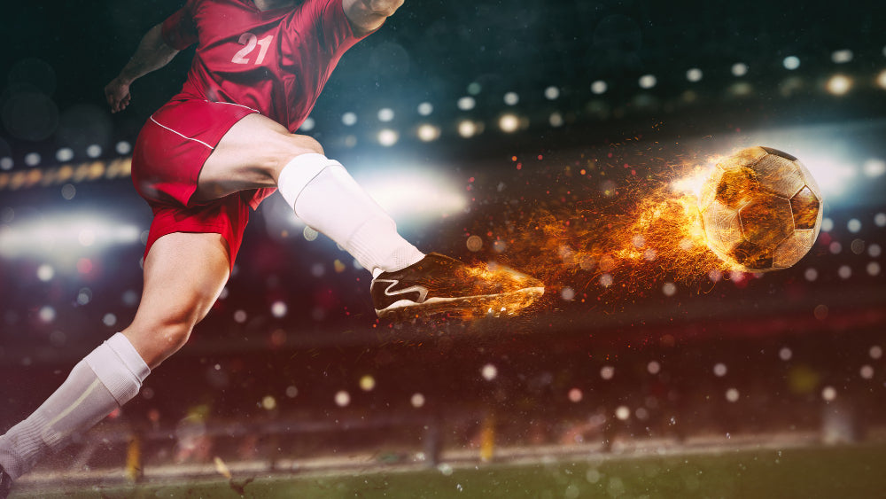 close-up-football-scene-night-match-with-player-red-uniform-kicking-fiery-ball-with-power