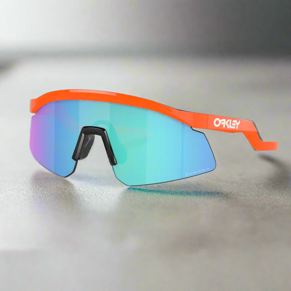 Oakley_HydraSunglass_NeonOrange_PrizmSapphire_Sideview_Instasport